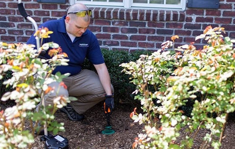 Man inspecting the outside of the home