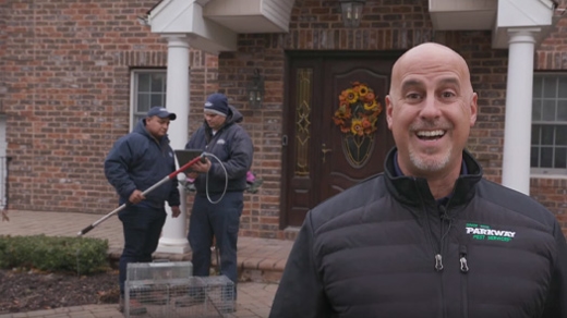 Three technicians outside a home.