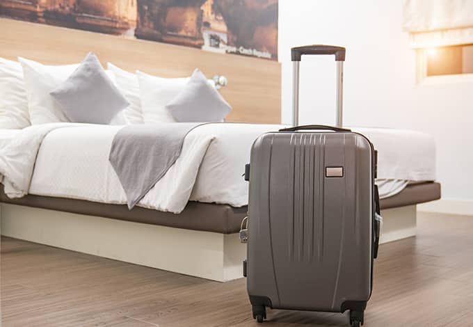 A suitcase in a hotel room