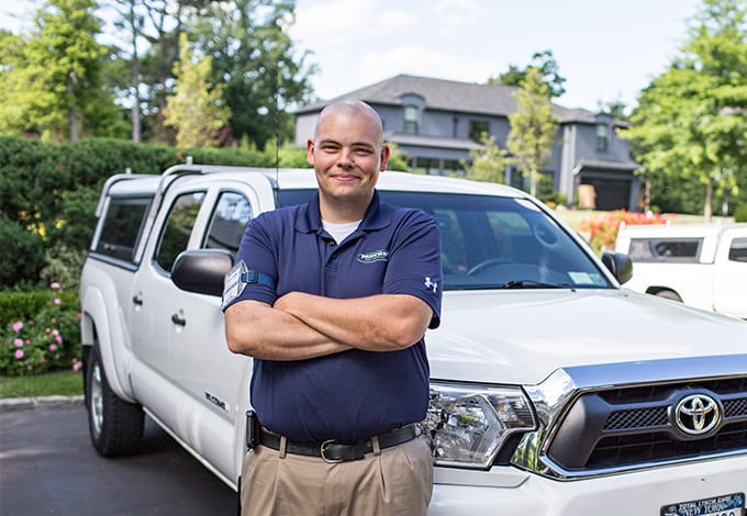 Pest control technician smiling