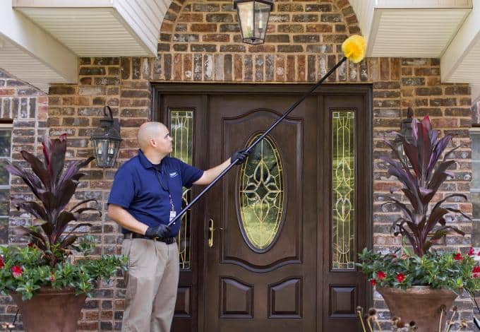 Technician wipe the roof of the front door house