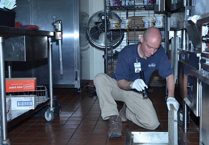 Technician servicing commercial kitchen